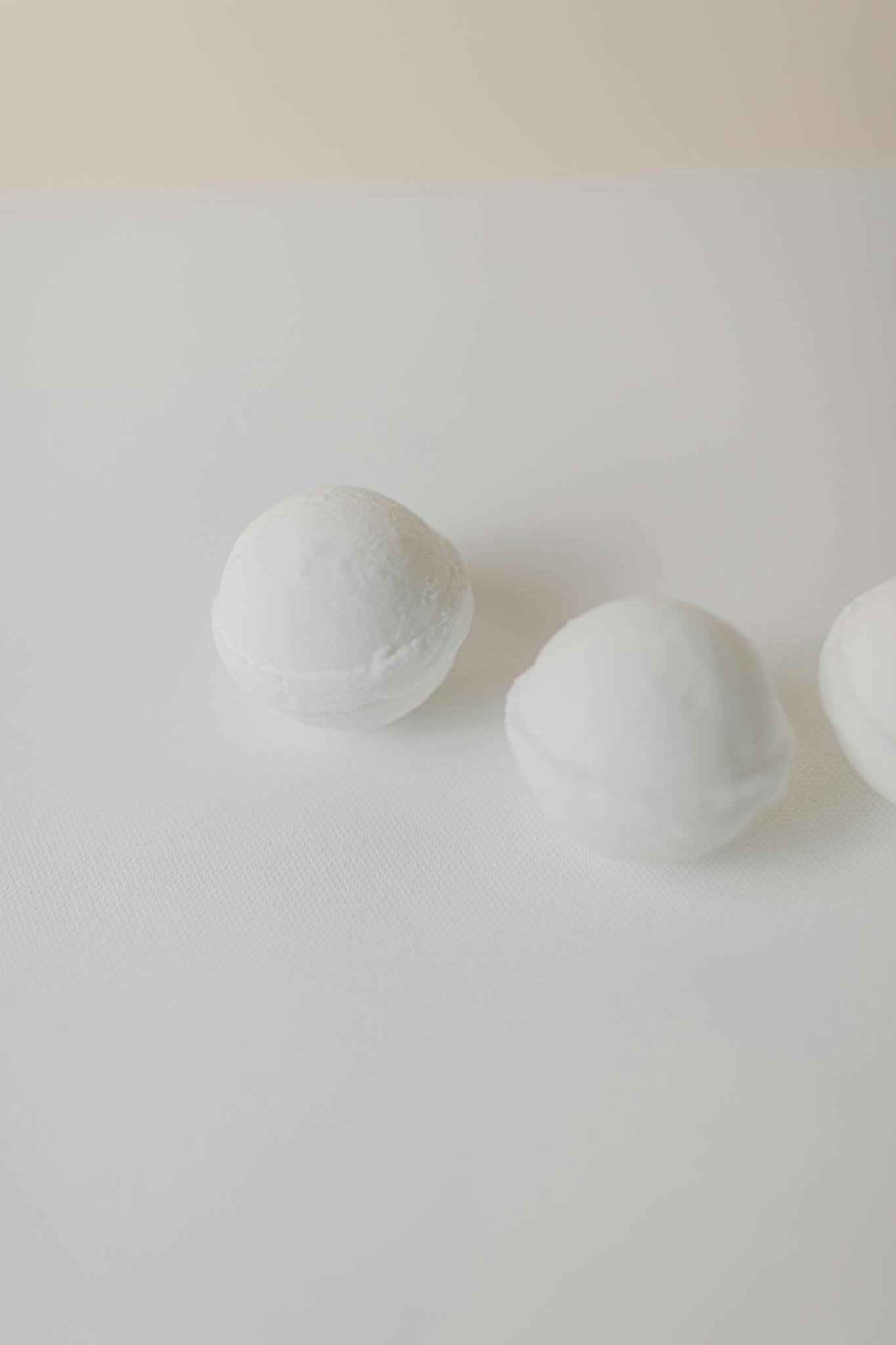 Contact us 21 elegant minimalistic presentation of white bath bombs Contact us